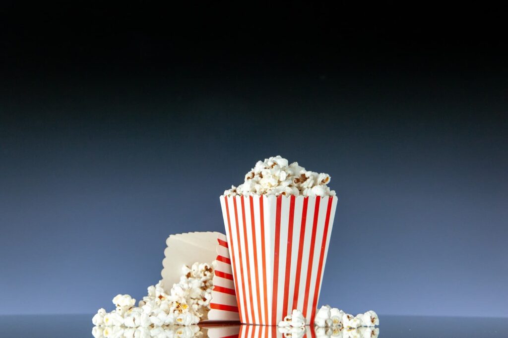 Front view retro cinema buckets of popcorn on dark